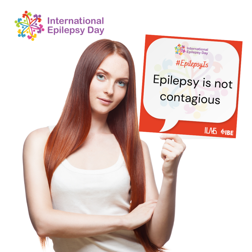 girl holding sign - epilepsy is not contagious